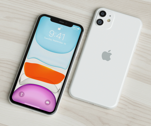 2 smartphones sobre a mesa. iPhone 11 preto em destaque no canto esquerdo com a tela para cima e branco do lado direito com tela voltada para baixo.